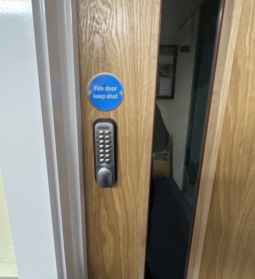 Keypad lock on an office fire door, UK locksmith job